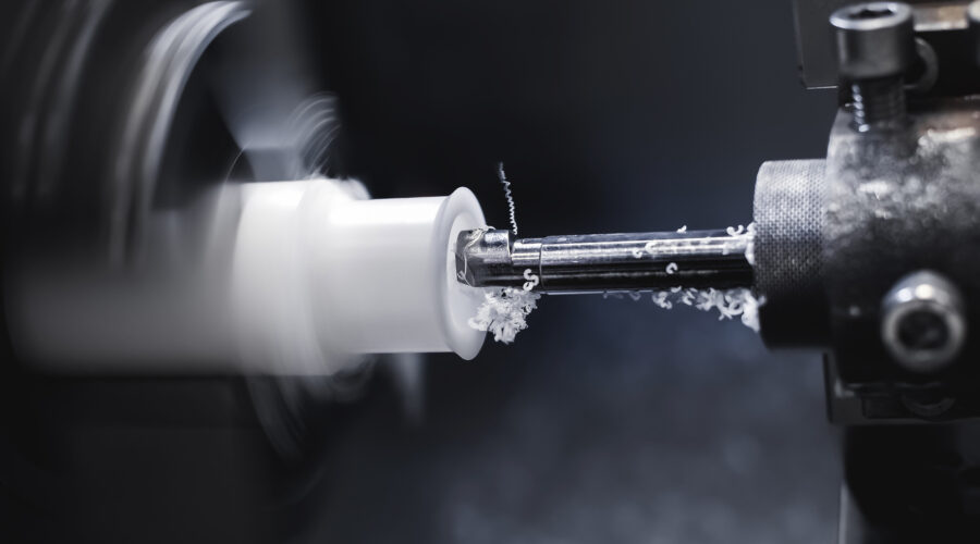 Lathe in the process of processing different materials.